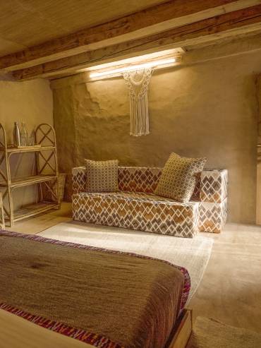 Relax in the warm, earthy ambiance of the mud house at Glampeco in Manali